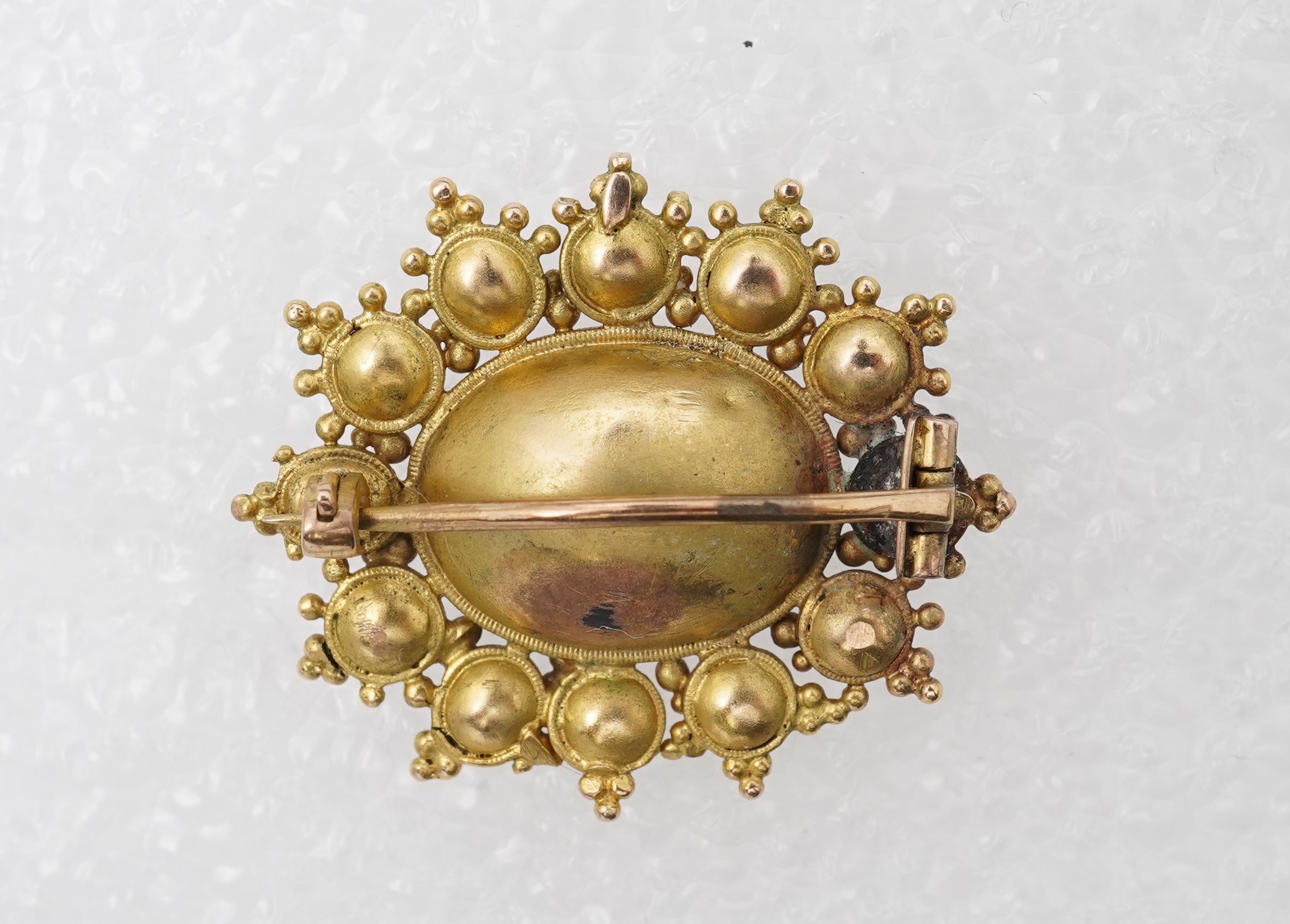 An amethyst and split pearl brooch, mid 19th century